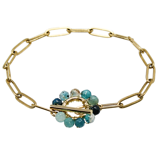A paperclip chain bracelet with a toggle closure. The toggle is beaded all around with wire and agate beads.