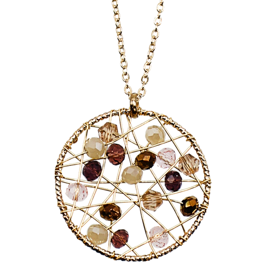 Gold pinwheel necklace beaded with wire and a variety of beads in the gold and brown color family.